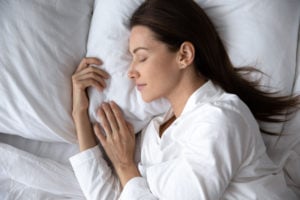 Woman sleeping with a pillow