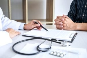 Doctor talking with patient