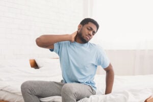 a man wakes up with body aches