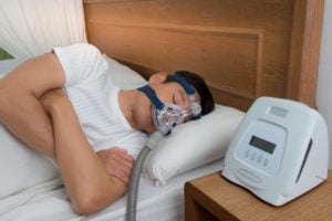 man using CPAP machine