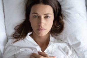 Woman sleeping with eyes open