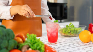 woman making a sleepy mocktail