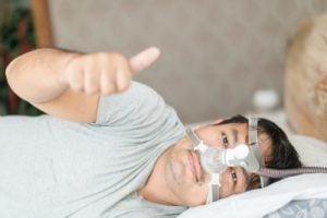 Stock image of man wearing cpap mask