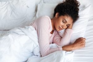 A woman enjoying sleep in the morning light