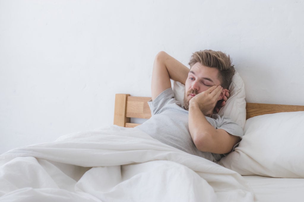 Man having a hard time waking up