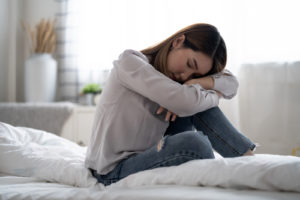 Woman in bed unable to sleep